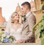 A couple on their wedding day inside a stone pagoda in the grounds of a hotel