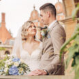 A couple on their wedding day inside a stone pagoda in the grounds of a hotel