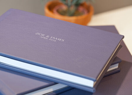 Stock style image of several leather wedding albums