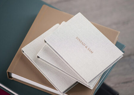 Stock style image of several linen wedding albums