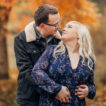 A couple embracing on a sunny autumnal day outdoors