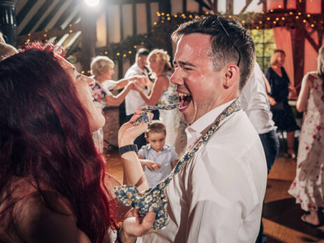 Guests at a wedding reception having fun and dancing in the evening